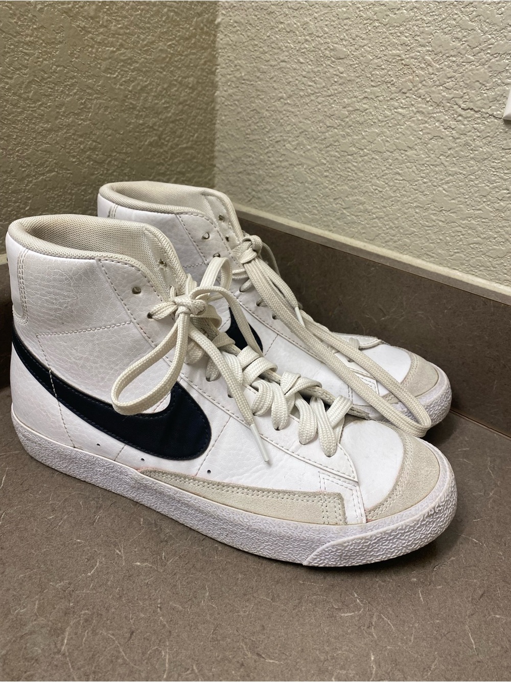 Nike White High-Top Sneakers with Black Swoosh